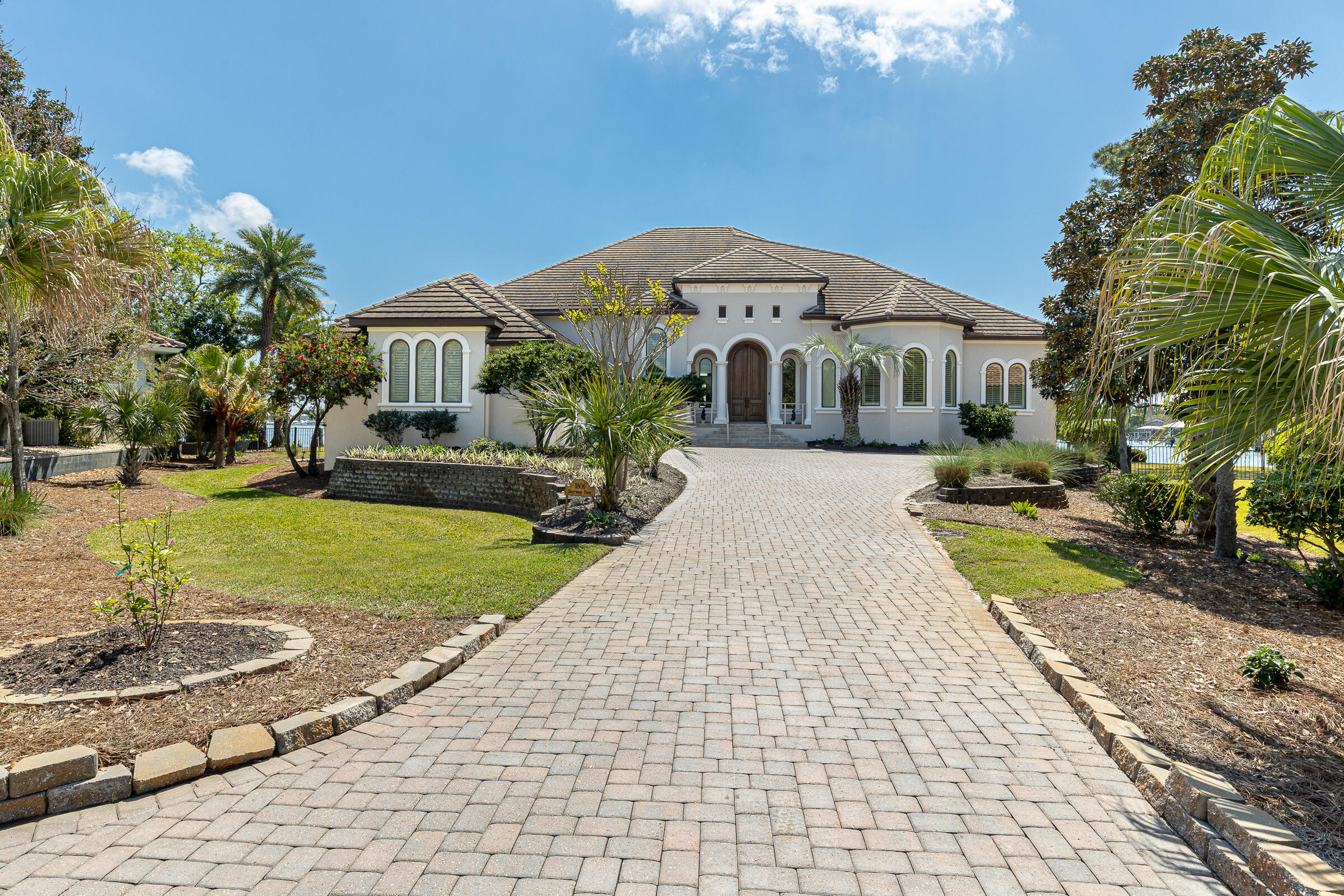 1806 Driftwood Point Road Santa Rosa Beach, FL 32459 - Photo 90 of 142 a front view of a house with garden