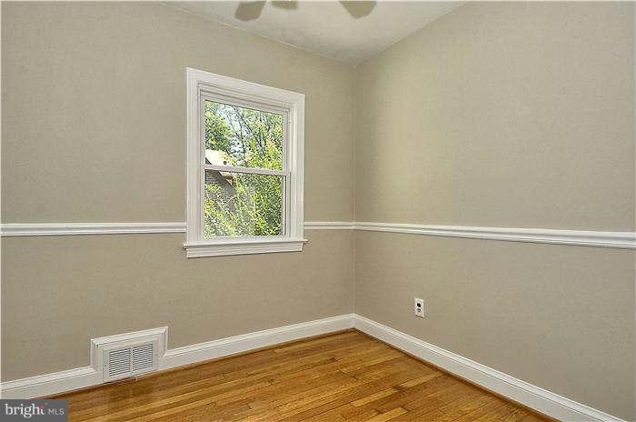 300 Dearborn Avenue Silver Spring, MD 20901 - Photo 21 of 30 a view of a small space with wooden floor and a window