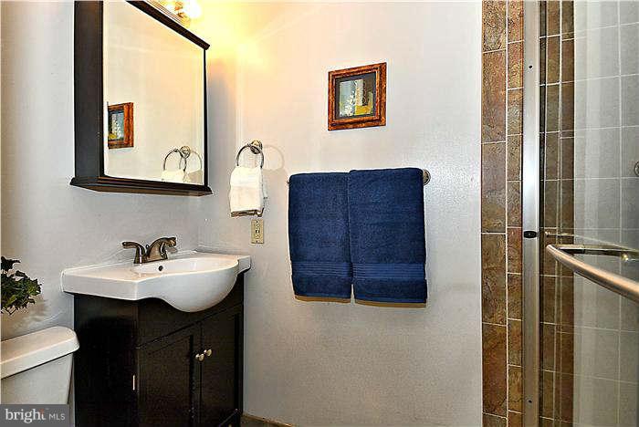 300 Dearborn Avenue Silver Spring, MD 20901 - Photo 24 of 30 a bathroom with a sink and a mirror