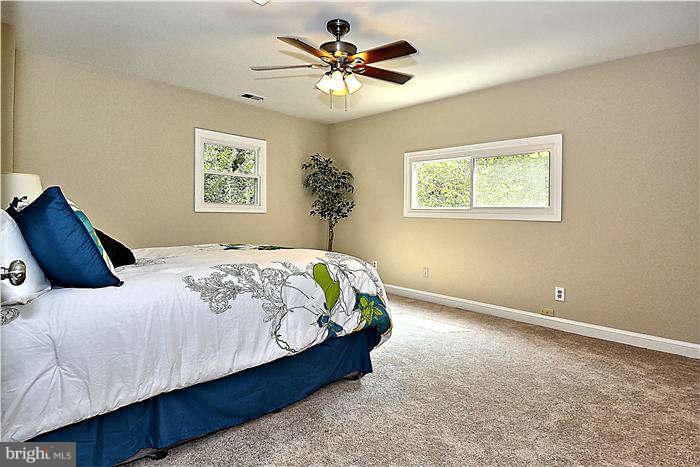 300 Dearborn Avenue Silver Spring, MD 20901 - Photo 25 of 30 a bedroom with a bed and a window