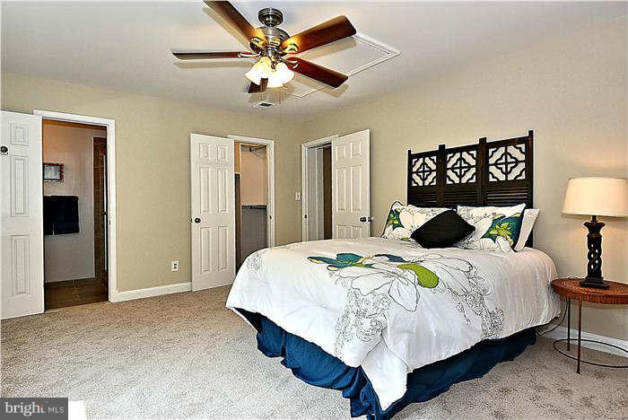 300 Dearborn Avenue Silver Spring, MD 20901 - Photo 26 of 30 a bedroom with a bed and a lamp