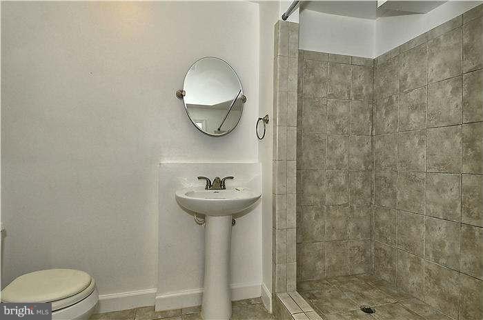 300 Dearborn Avenue Silver Spring, MD 20901 - Photo 28 of 30 a bathroom with a sink toilet and shower