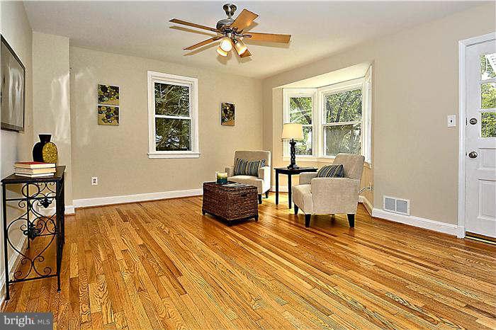 300 Dearborn Avenue Silver Spring, MD 20901 - Photo 8 of 30 a living room with furniture and a wooden floor