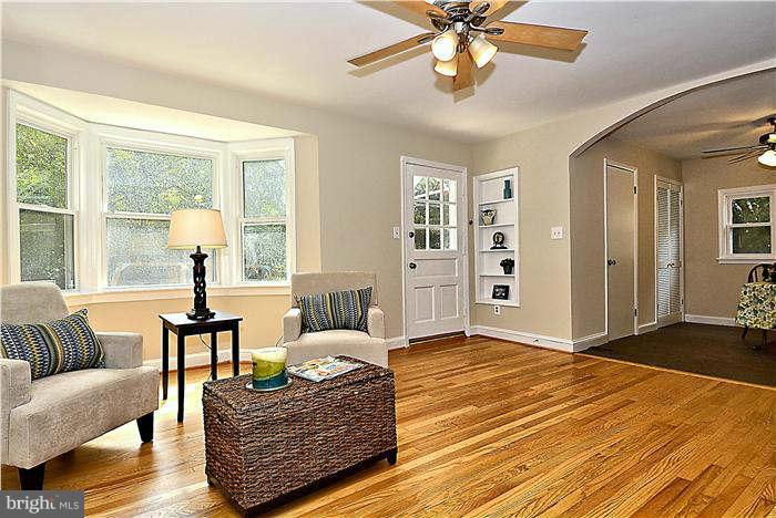 300 Dearborn Avenue Silver Spring, MD 20901 - Photo 9 of 30 a living room with furniture and wooden floor