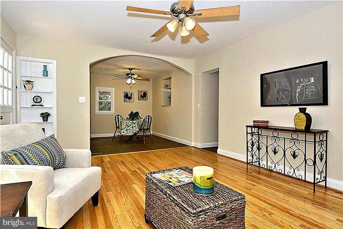 300 Dearborn Avenue Silver Spring, MD 20901 - Photo 10 of 30 a living room with furniture and wooden floor