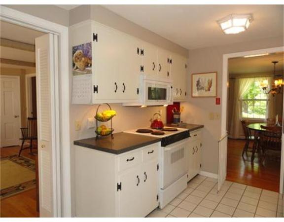 471 Bay Road Amherst, MA 01002 - Photo 11 of 30 a kitchen with a sink cabinets and wooden floor