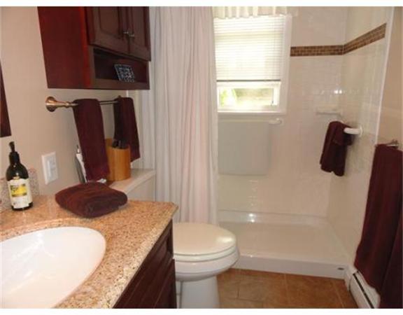 471 Bay Road Amherst, MA 01002 - Photo 15 of 30 a bathroom with a granite countertop sink toilet and shower