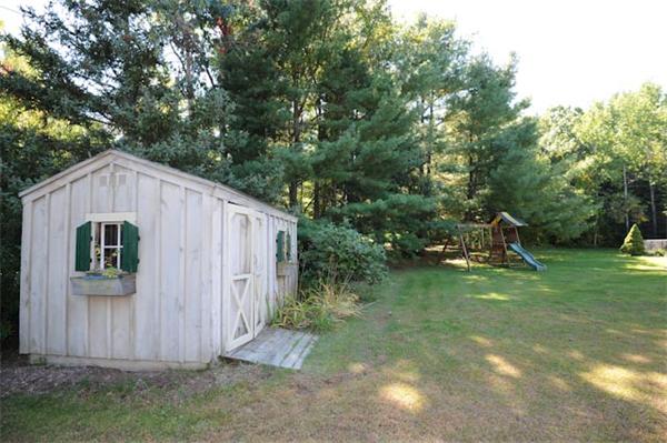471 Bay Road Amherst, MA 01002 - Photo 27 of 30 a backyard of a house with plants and tree