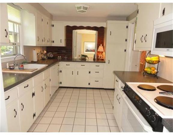 471 Bay Road Amherst, MA 01002 - Photo 10 of 30 a kitchen with granite countertop a sink a stove top oven a counter space and cabinets