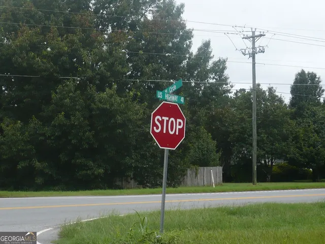 a view of a street with a park