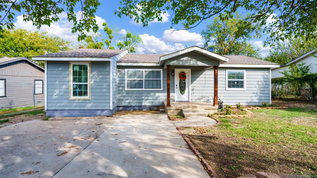 4433 Moler Street Dallas, TX 75211 - Photo 1 of 1 a front view of a house with a yard and garage