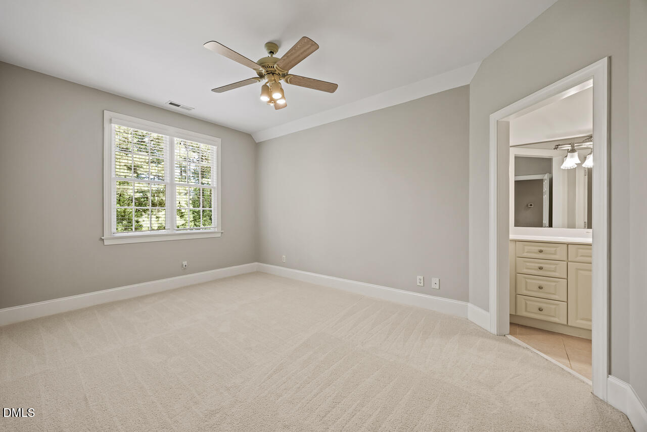 4004 Frontenac Court Apex, NC 27539 - Photo 42 of 61 an empty room with windows and fan