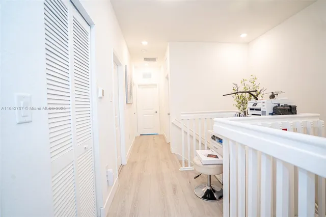 a bathroom with a sink and mirror with toilet