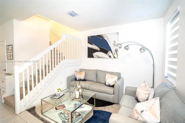 a living room with furniture and rug