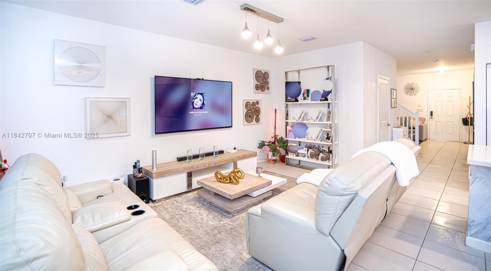 10118 Southwest 231st Lane Miami, FL 33190 - Photo 4 of 19 a living room with furniture and view of kitchen