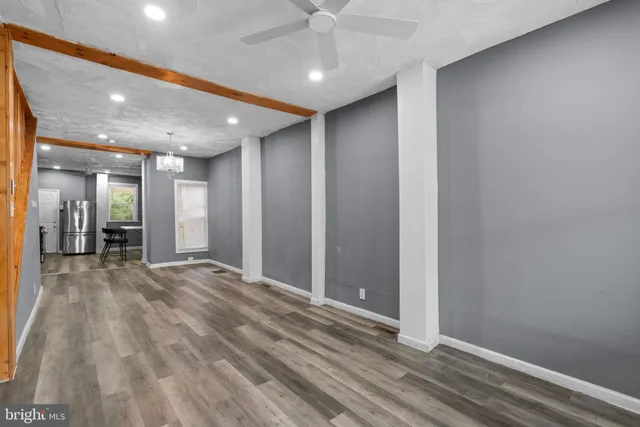 a view of a hallway with a room