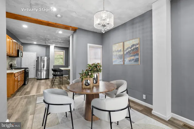 a dining room with furniture and window