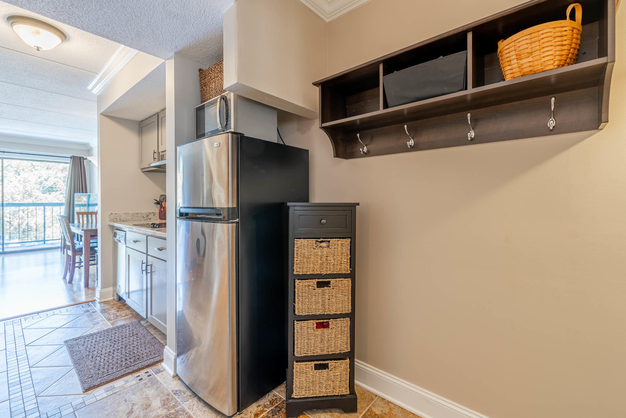 306 Baskins Creek Road, Unit 403 Gatlinburg, TN 37738 - Photo 3 of 11 a kitchen with a refrigerator and cabinets