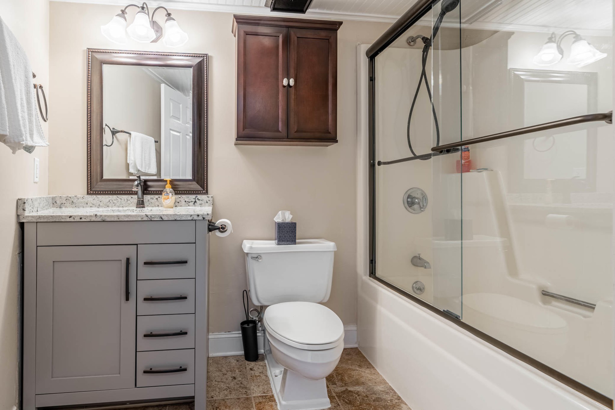306 Baskins Creek Road, Unit 403 Gatlinburg, TN 37738 - Photo 8 of 11 a bathroom with a granite countertop sink toilet and shower
