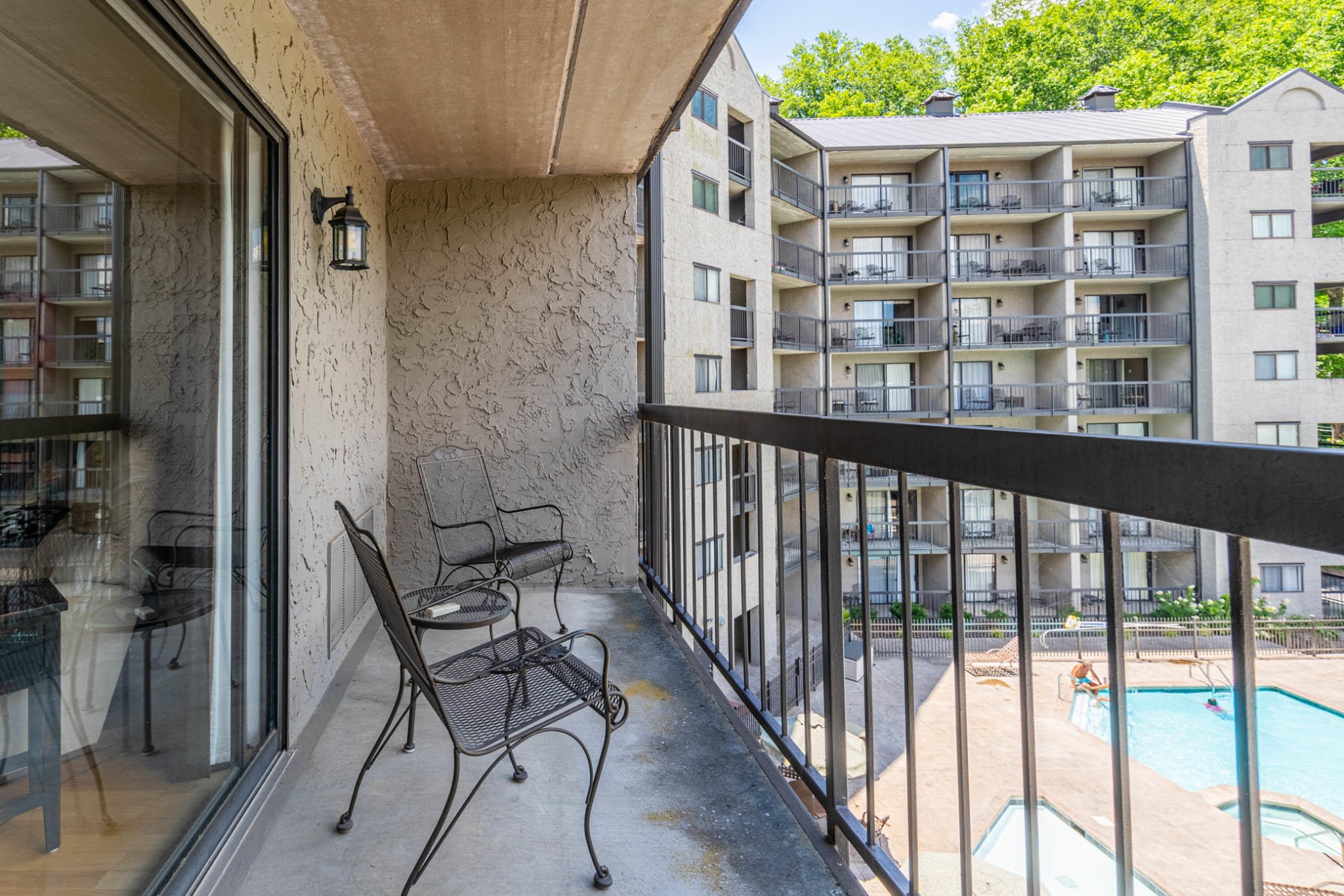 306 Baskins Creek Road, Unit 403 Gatlinburg, TN 37738 - Photo 9 of 11 a view of a balcony with chairs