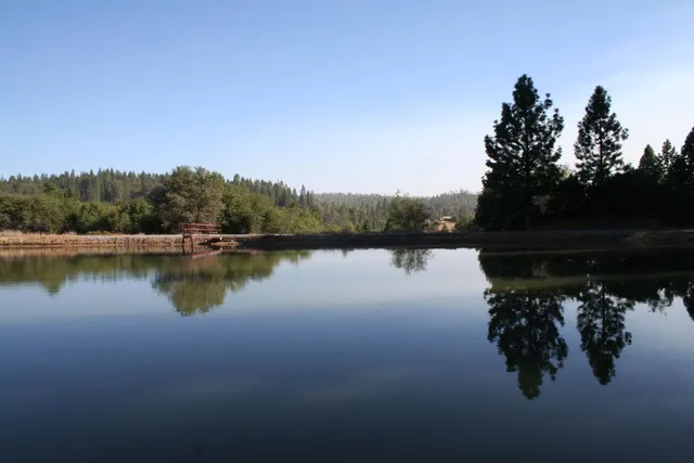 a view of a lake in between two of the house