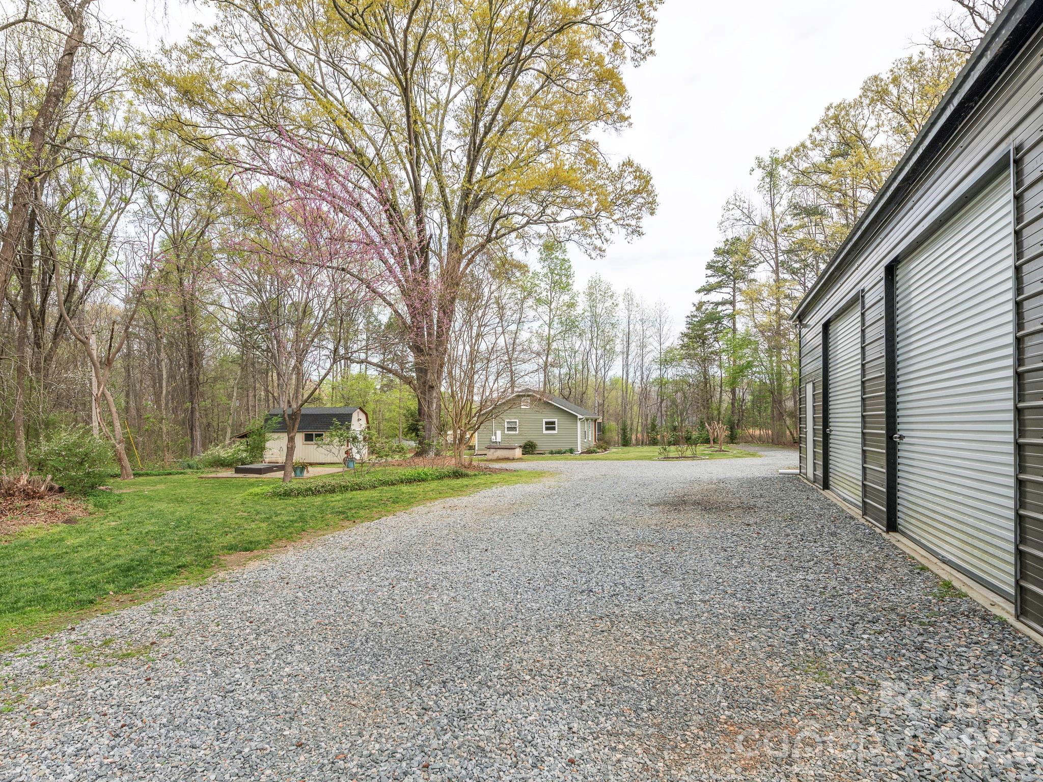 8202 Karriker Road Kannapolis, NC 28081 - Photo 1 of 12 a view of a house with a yard and large trees