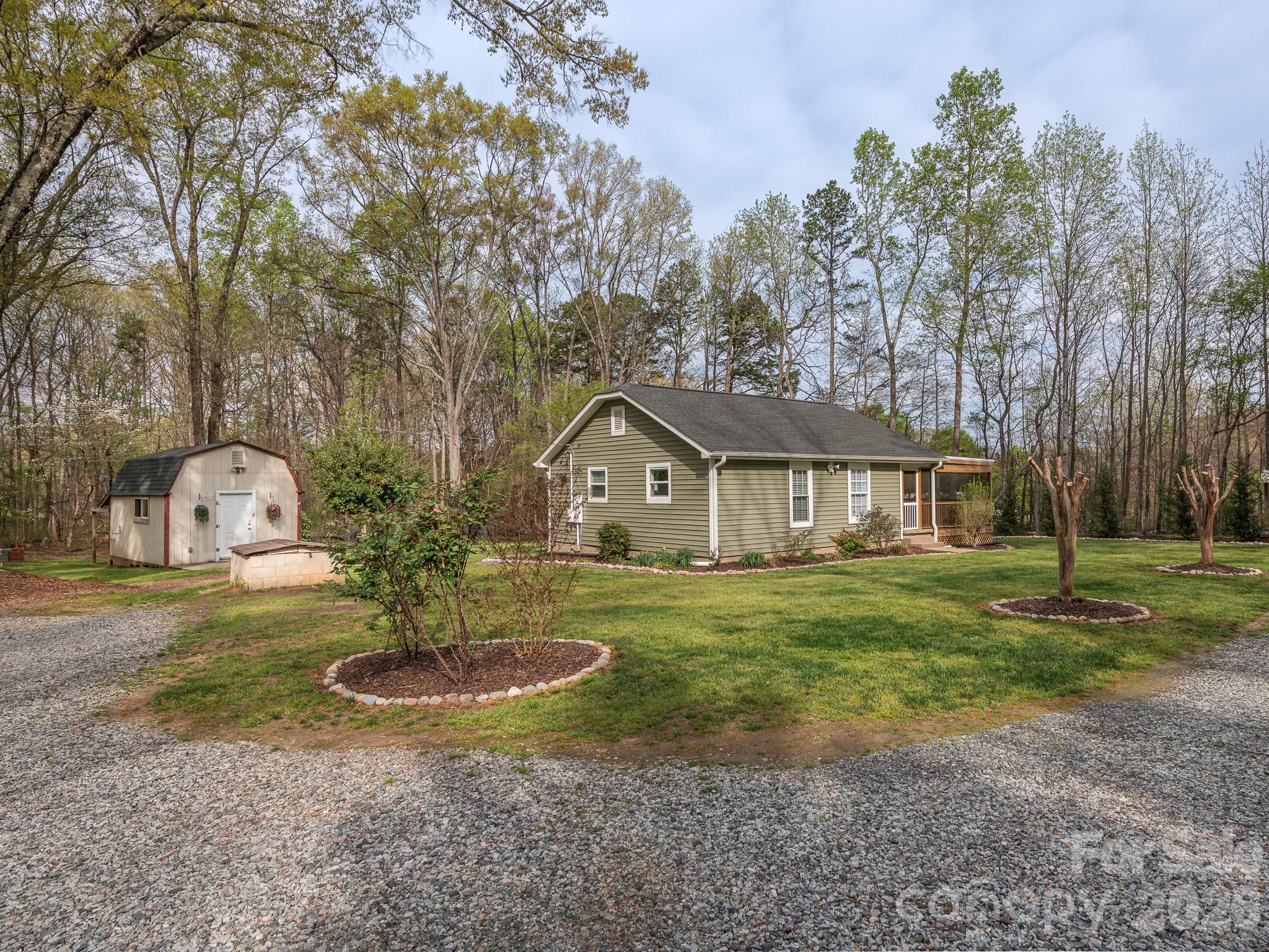 8202 Karriker Road Kannapolis, NC 28081 - Photo 2 of 12 a front view of a house with a yard and trees
