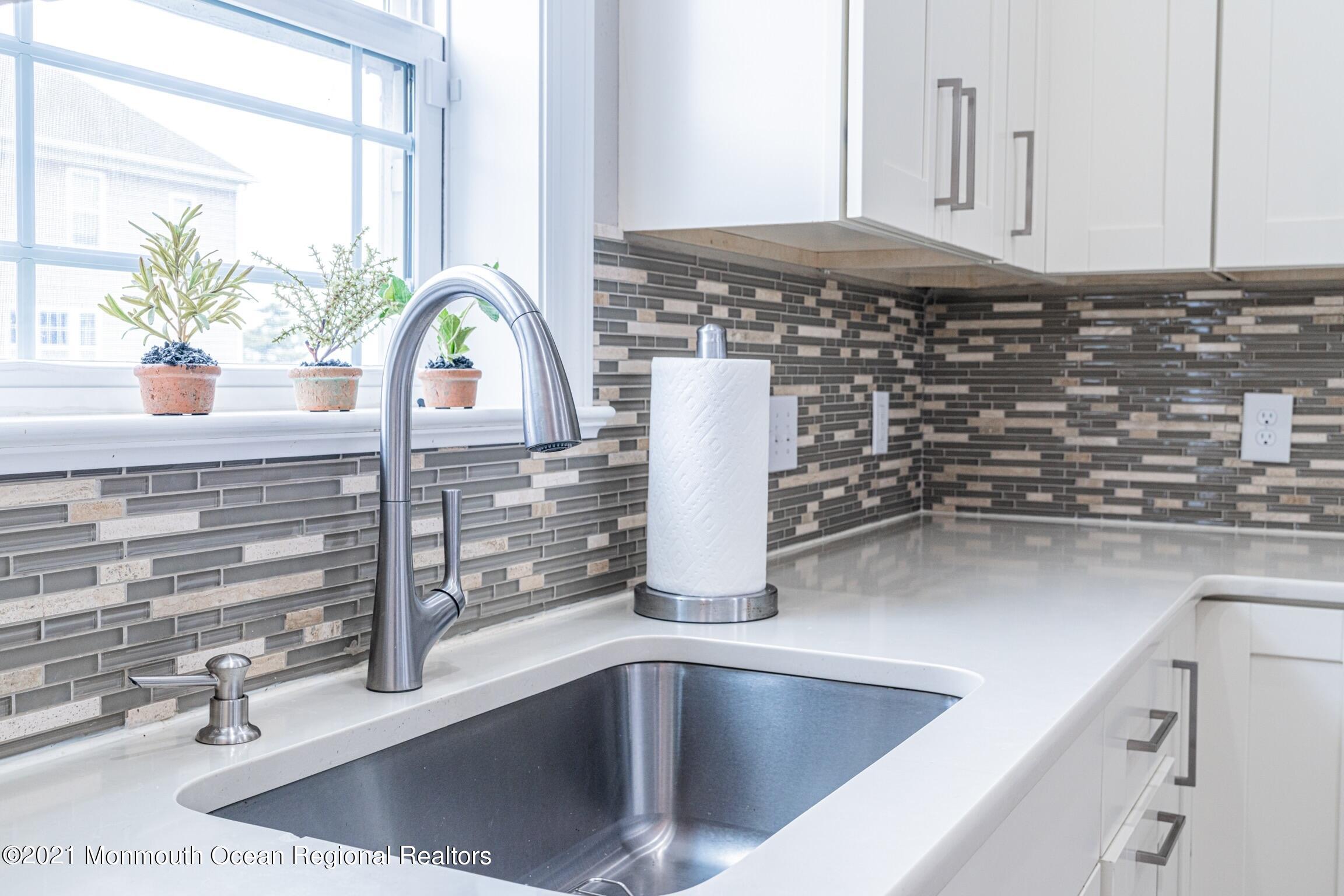 67 Ocean Terrace Long Branch, NJ 07740 - Photo 2 of 20 a kitchen with a sink and a window