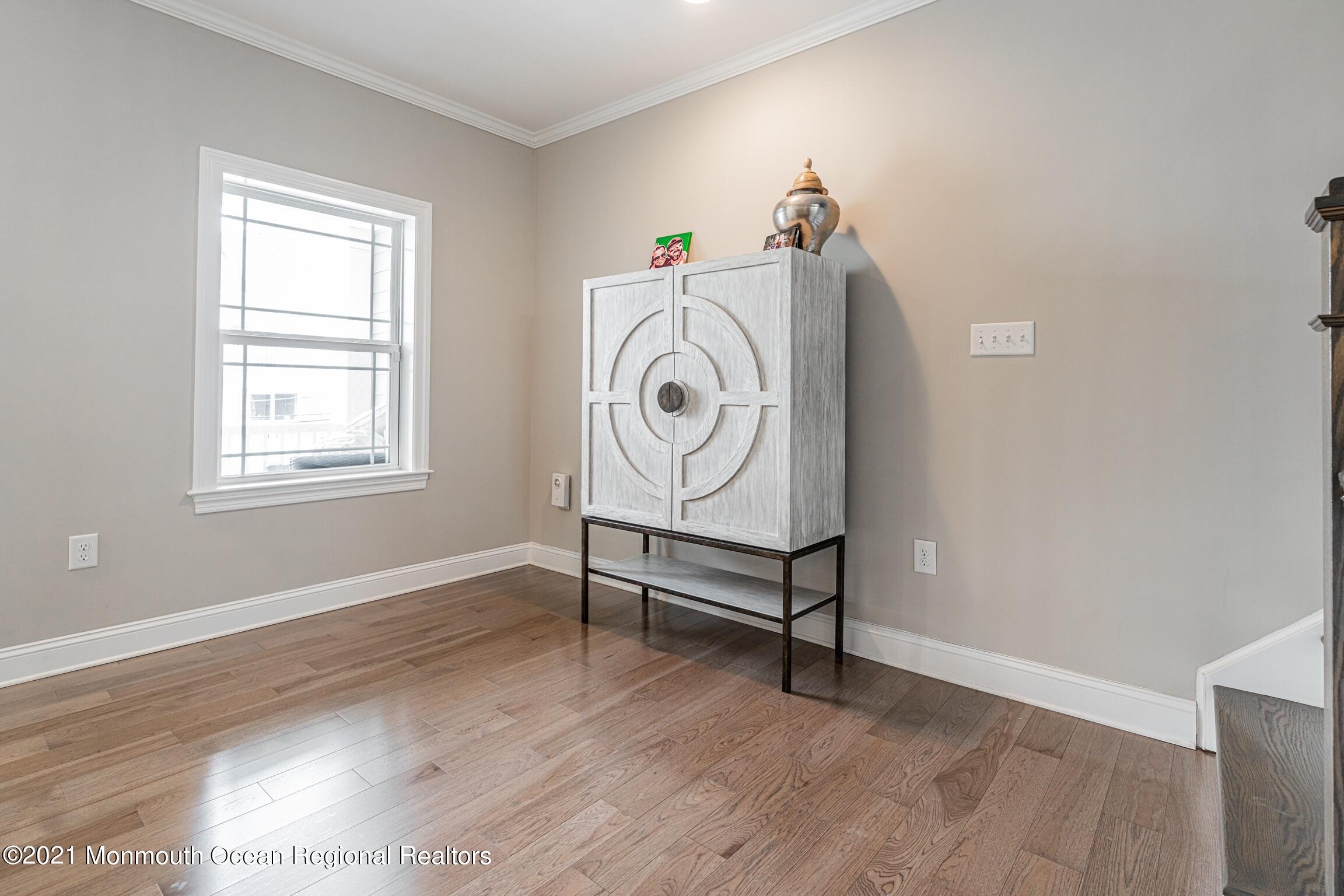 67 Ocean Terrace Long Branch, NJ 07740 - Photo 12 of 20 a view of a livingroom with wooden floor and a window