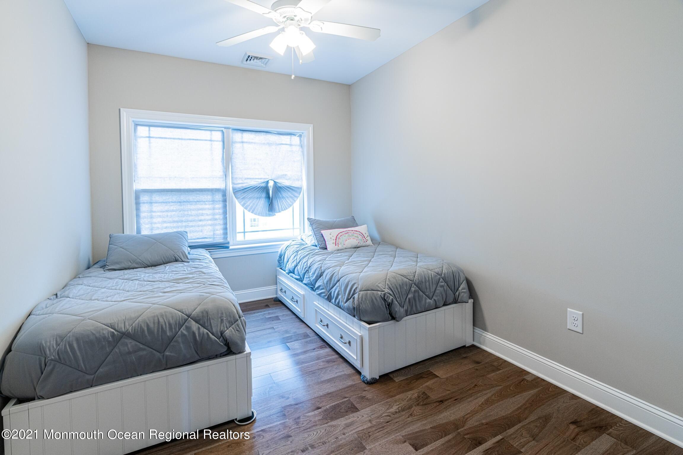 67 Ocean Terrace Long Branch, NJ 07740 - Photo 16 of 20 a bedroom with a bed and a window