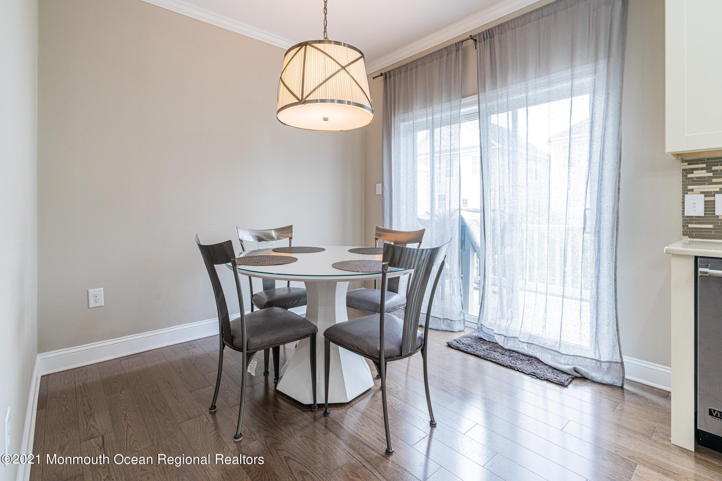 67 Ocean Terrace Long Branch, NJ 07740 - Photo 6 of 20 a view of a dining room with furniture window and wooden floor