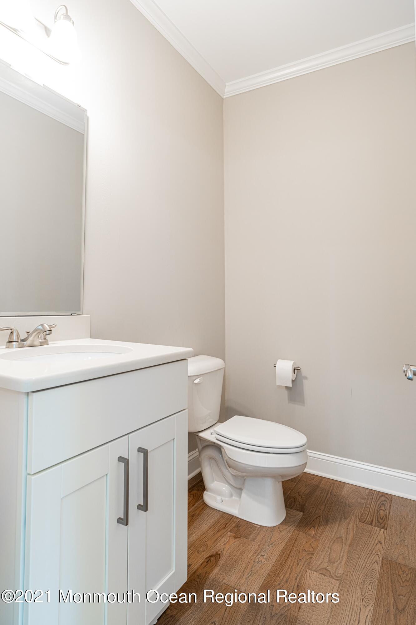 67 Ocean Terrace Long Branch, NJ 07740 - Photo 7 of 20 a bathroom with a sink a toilet and a mirror