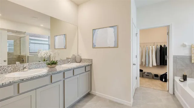 a en suite bathroom with a sink and a mirror
