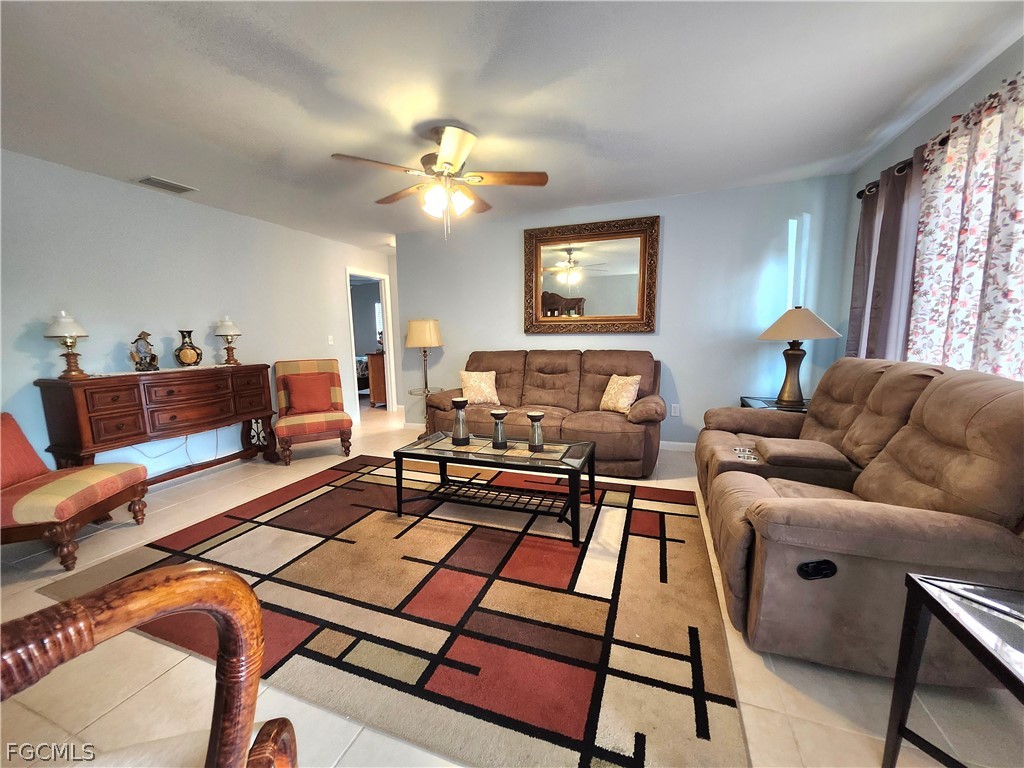 12938 5th Street Fort Myers, FL 33905 - Photo 1 of 25 a living room with furniture a table and a window