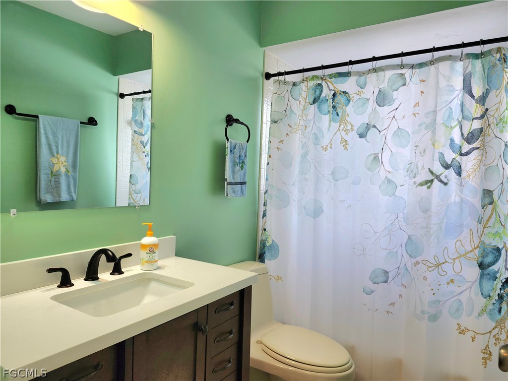 12938 5th Street Fort Myers, FL 33905 - Photo 12 of 25 a bathroom with a sink and toilet
