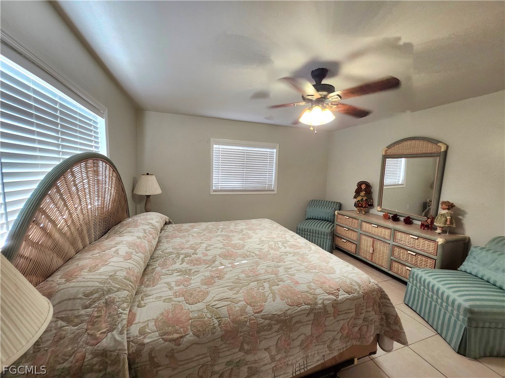 12938 5th Street Fort Myers, FL 33905 - Photo 16 of 25 a bedroom with a bed couches and flat screen tv
