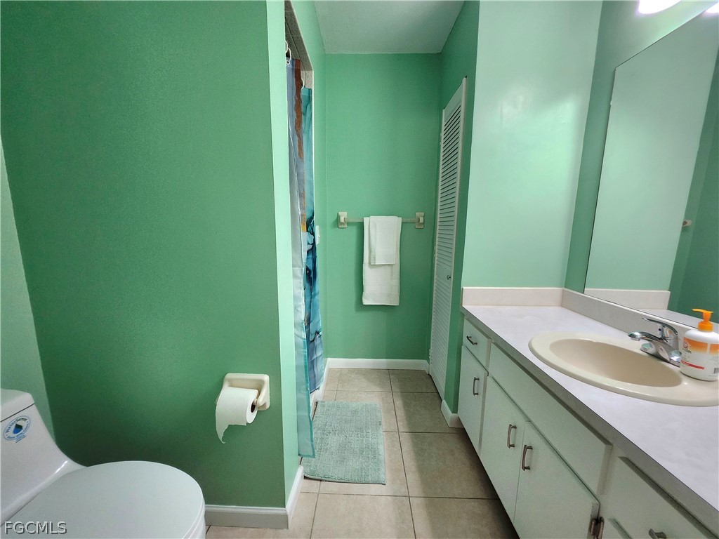 12938 5th Street Fort Myers, FL 33905 - Photo 17 of 25 a bathroom with a granite countertop toilet sink and mirror