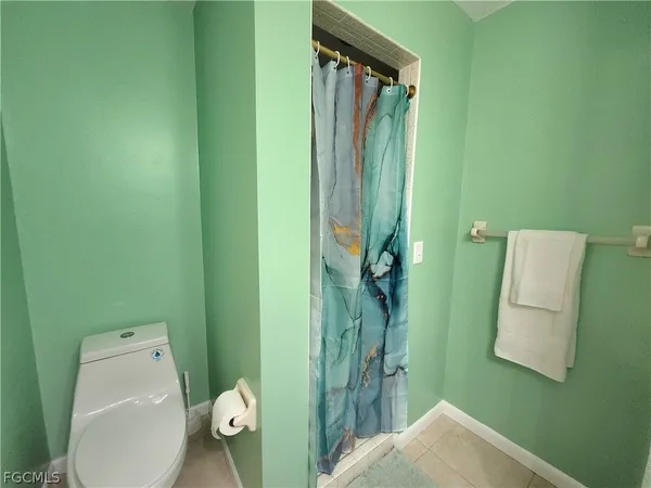 a bathroom with a toilet and a sink