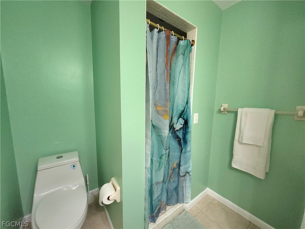 12938 5th Street Fort Myers, FL 33905 - Photo 18 of 25 a bathroom with a toilet and a sink