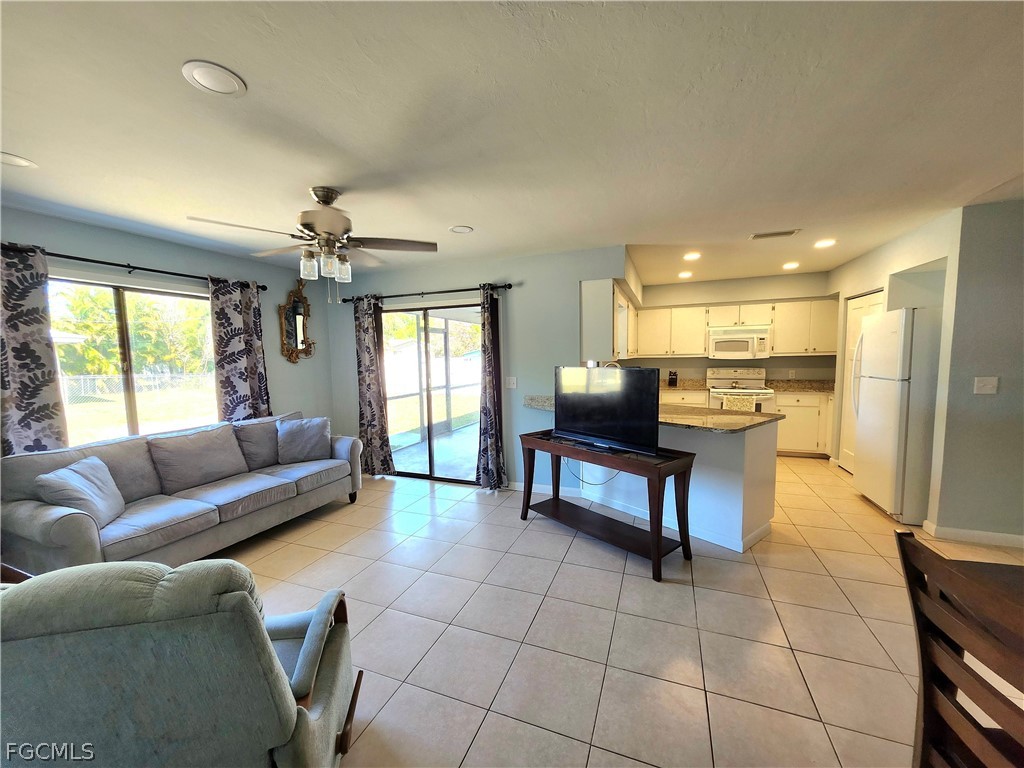 12938 5th Street Fort Myers, FL 33905 - Photo 19 of 25 a living room with furniture and a large window