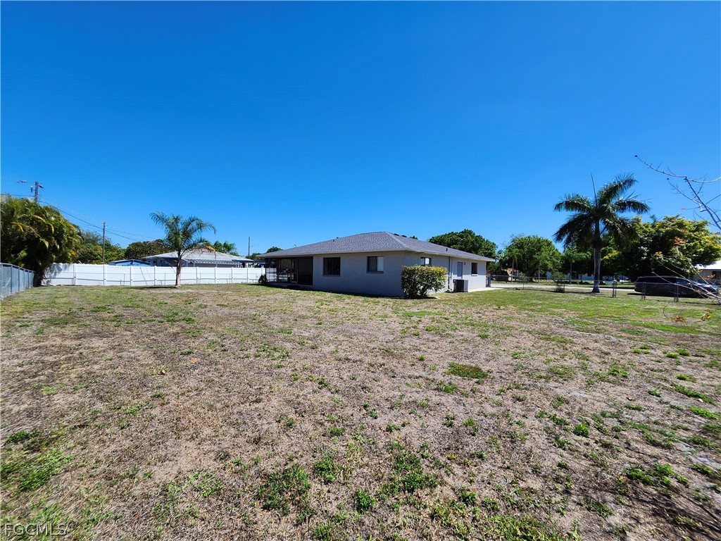 12938 5th Street Fort Myers, FL 33905 - Photo 23 of 25 a front view of a house with a yard