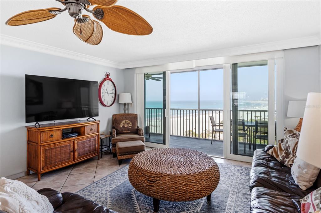 6300 Midnight Pass Road, Unit 708 Sarasota, FL 34242 - Photo 16 of 49 a living room with furniture a flat screen tv and a window