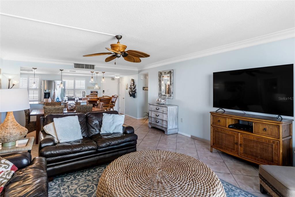 6300 Midnight Pass Road, Unit 708 Sarasota, FL 34242 - Photo 22 of 49 a living room with furniture and a flat screen tv