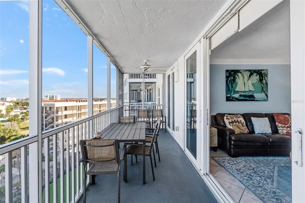 6300 Midnight Pass Road, Unit 708 Sarasota, FL 34242 - Photo 25 of 49 a view of a chairs and table in a balcony