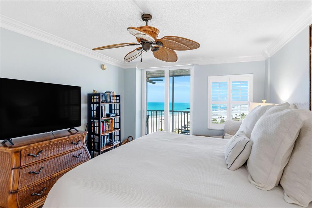 6300 Midnight Pass Road, Unit 708 Sarasota, FL 34242 - Photo 28 of 49 a bedroom with a bed and a flat screen tv