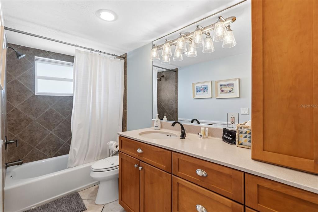 6300 Midnight Pass Road, Unit 708 Sarasota, FL 34242 - Photo 34 of 49 a bathroom with a sink a toilet and shower