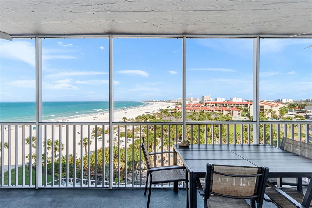 6300 Midnight Pass Road, Unit 708 Sarasota, FL 34242 - Photo 4 of 49 a view of a chairs and table in the balcony