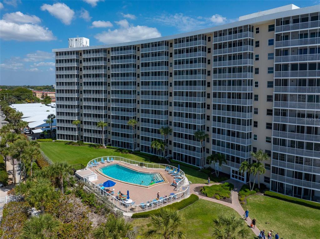 6300 Midnight Pass Road, Unit 708 Sarasota, FL 34242 - Photo 49 of 49 a view of a building with a yard