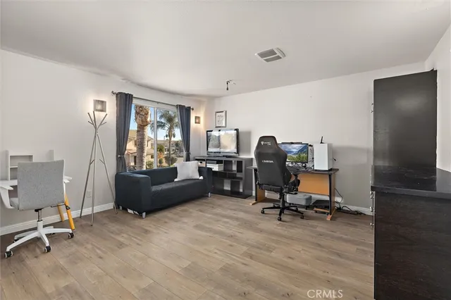 a view of a workspace with furniture and a livingroom