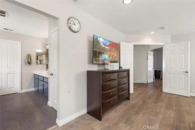 a room with furniture and a flat screen tv